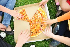 family eating pizza