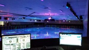 View from DJ booth of skating rink under colorful lights