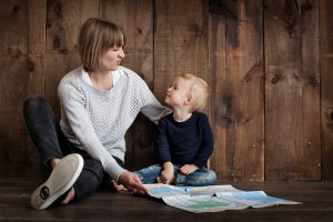 Mom and toddler son with map