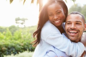 Happy couple embracing and smiling