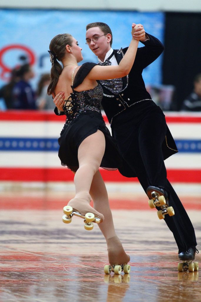 a man and a woman figure roller skating