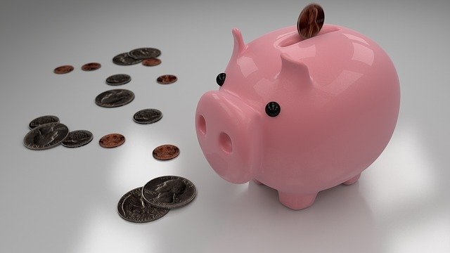 Pink piggy bank with coins
