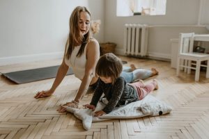 Mom and small child doing yoga