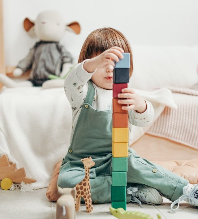 Small child playing with blocks